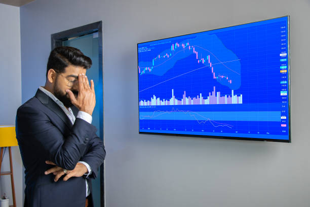 stress stock market trader or businessman standing looking at screen shows candlesticks chart graphic going down, financial market crash. crypto trading. - gambling loss asian ethnicity depression imagens e fotografias de stock