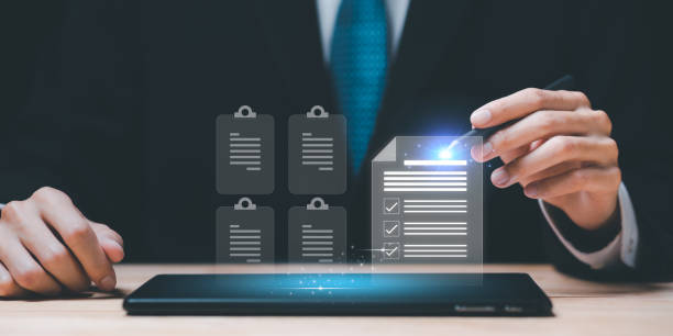 istock Auditor checking office documents ,Management of important document storage of organization ,ERP document system ,accountant Audit documents , quality assessment  With a checklist ,online database 1496284730