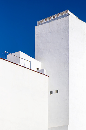 White colored residential building exterior in sunlight , in Tenerife, Spain
