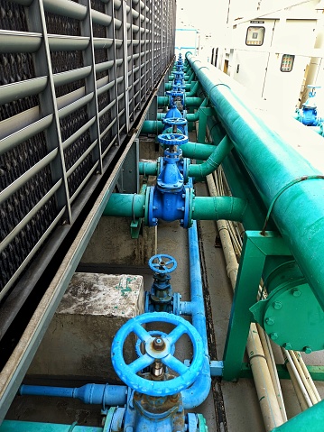 Rows of valves as part of the Cooling tower system.