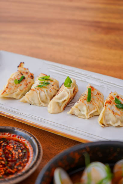istock Korean Dimsum in a White Plate and Sauce 1496288715