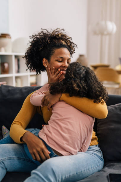 istock multiracial woman at home playing with her daughter 1496289959