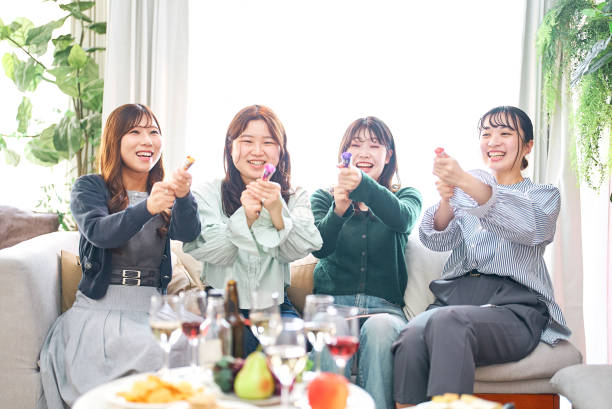 istock Four women excited with crackers 1496291356