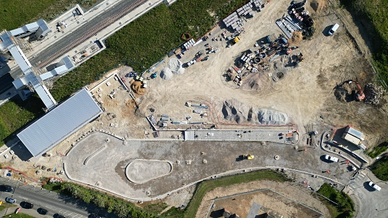 An aerial view of a large expanse of train station construction