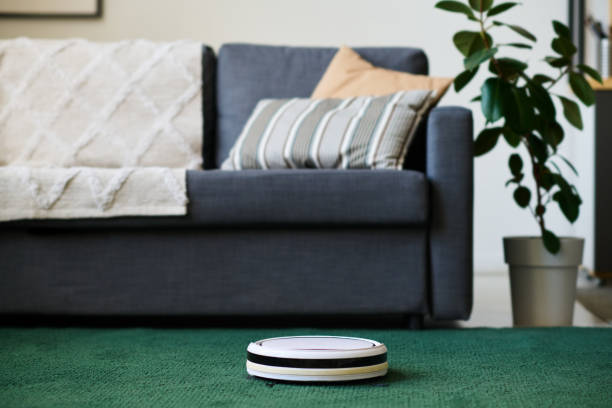 istock Robot vacuum cleaner vacuuming the room 1496295250