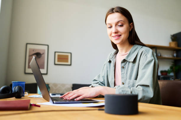 istock Young woman talking to smart speaker 1496295938