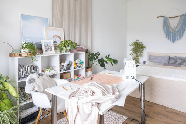 istock Modern workplace of tailor textile craft designer table with sewing machine 1496295940