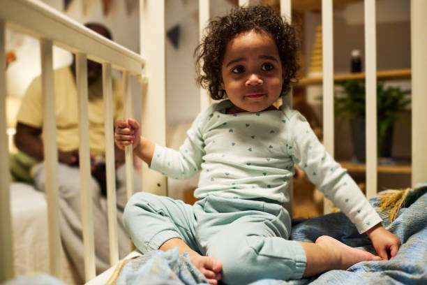 istock Cute baby sitting in cob in the room 1496297765