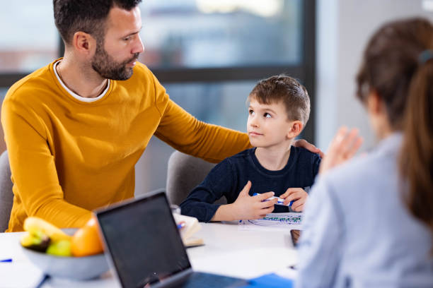 istock Single father and his son having a counseling session. 1496297991