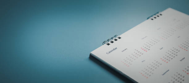 istock Embroidered red pins on a calendar event Planner calendar,clock to set timetable organize schedule,planning for business meeting or travel planning concept. 1496299761