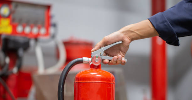 istock Engineer are checking and inspection a fire extinguishers tank in the fire control room for safety training and fire prevention. 1496299777