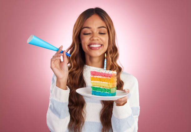 istock Woman, birthday and rainbow cake in studio with smile, excited face and happiness by gradient background. Happy model, girl and dessert with celebration, event or achievement at party by backdrop 1496302995