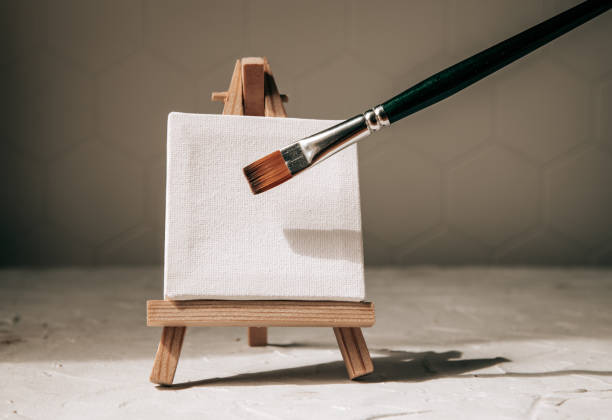 istock A brush on the background of a small easel. drawing concept 1496303405