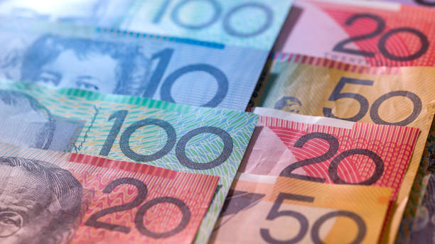 istock Banknotes of australian dollars in rows as background 1496305273