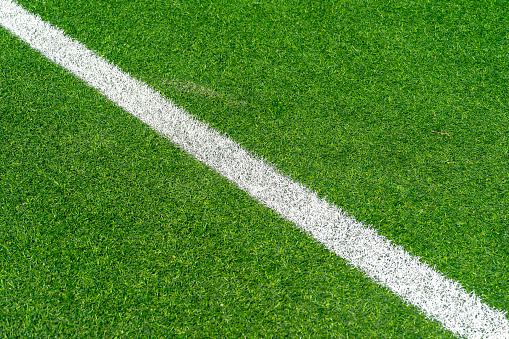 White line on grass on soccer field