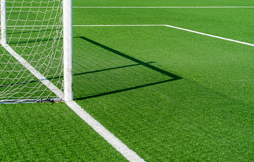 Close-up of two young soccer players duelling for the ball possesion