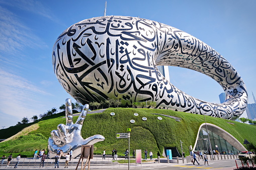 Museum of the Future exhibition space with iconic torus shape and façade of stainless steel and windows that form an Arabic poem designed by Killa Design. Dubai, UAE - April, 2023