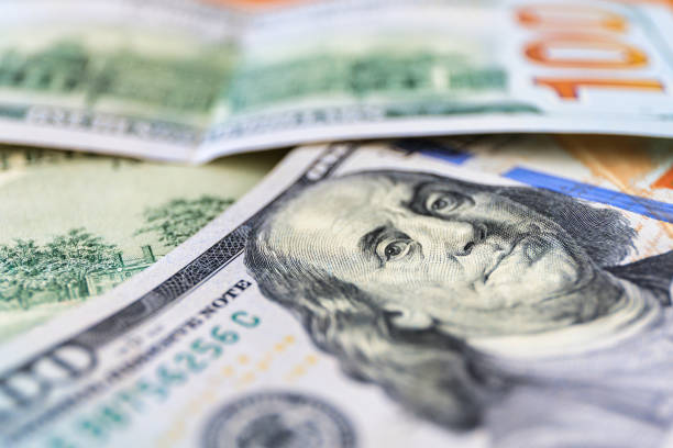 istock 100 dollar bills on the table at home 1496309535