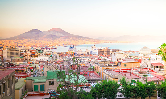 cityscape Naples and Vesuvius volcano at sunset, Italy