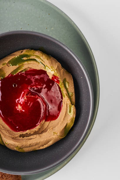 istock Pate with raspberry coulis in a bowl with a baguette on a gray background 1496313032