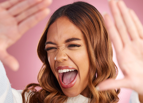 Wow, hands and woman screaming in studio for selfie, announcement or good news of sale on pink background. Face, shouting and girl excited, shocked and surprised by discount, promotion or photo