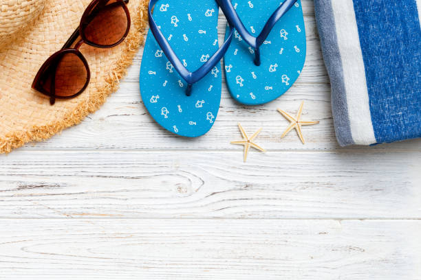 istock Summer vacation concept flat lay. straw hat beach accessories and towel top view. Space for text. travel concept 1496314519