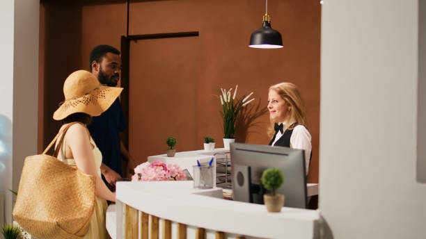 istock Hotel staff welcoming guests 1496314579