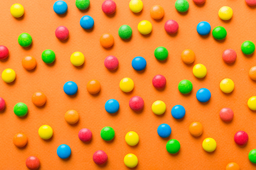 colorful candies as background top view. Seamless pattern with candy. Many sweet candies close-up.