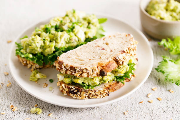 istock Healthy breakfast toast with avocado egg salad. 1496314906