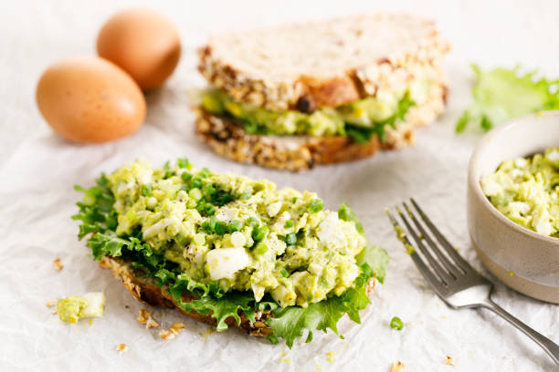 istock Healthy breakfast toast with avocado egg salad. 1496314915