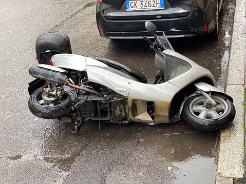 Cremona, Italy - May 2023 Scooter fallen in the street. Traffic Accident.
