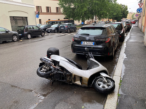 Cremona, Italy - May 2023 Scooter fallen in the street. Traffic Accident.