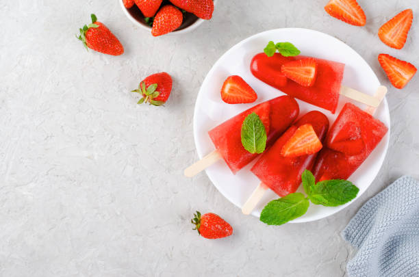 istock Refreshing Strawberry Popsicles, Ice Lolly with Fresh Strawberry and Mint on Bright Background 1496315940