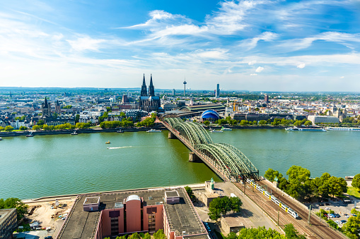 Cologne, North Rhine Westphalia, Germany: Beautiful panoramic aerial landscape of the gothic catholic Cologne cathedral, Hohenzollern Bridge and the River Rhine.