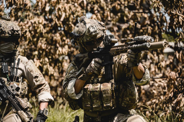 istock Soldiers running forward and attacking enemy during military operation 1496317555