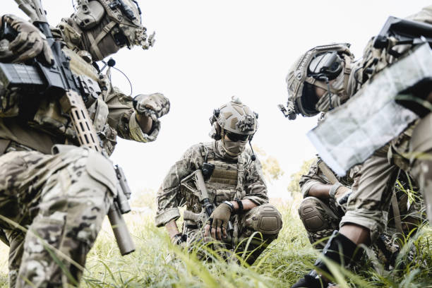 istock Soldiers running forward and attacking enemy during military operation 1496317669