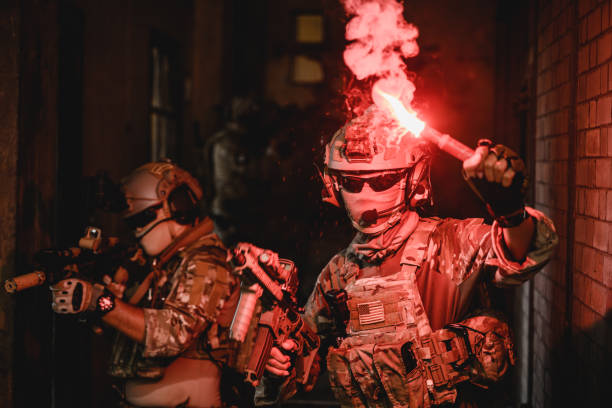 istock Expert team of soldiers attacking enemy during military operation 1496318920