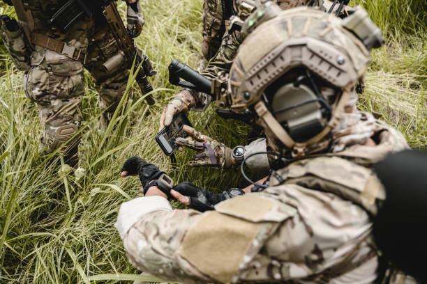 istock Smart teamwork of soldiers running forward and attacking enemy 1496319348