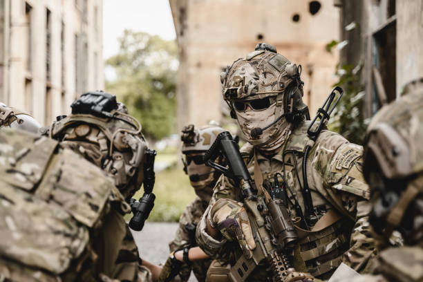 istock Smart teamwork of soldiers running forward and attacking enemy 1496319483