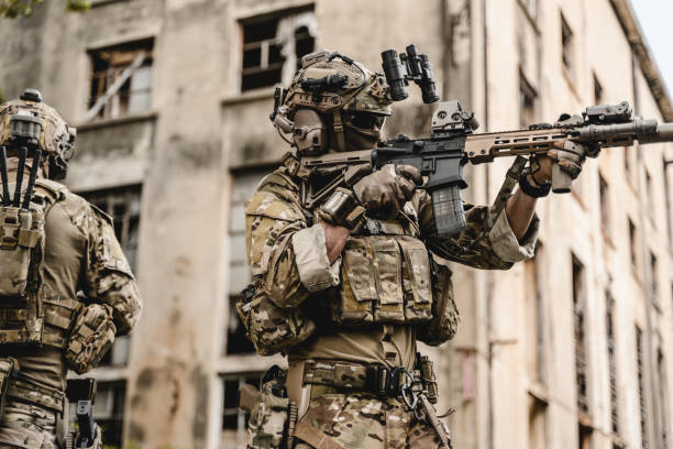 istock Expert team of soldiers attacking enemy during military operation 1496320079