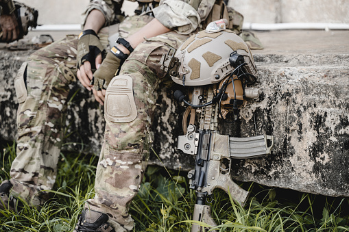 Smart teamwork of soldiers running forward and attacking enemy during military operation, Army soldiers in protective combat uniform, Soldiers with rifle, Soldiers with rifle on world war field