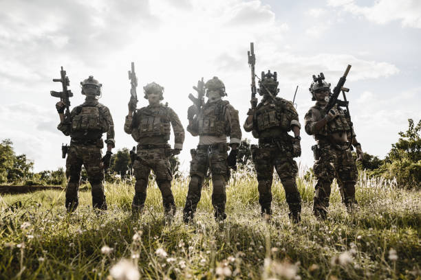 istock Smart teamwork of soldiers running forward and attacking enemy 1496321158