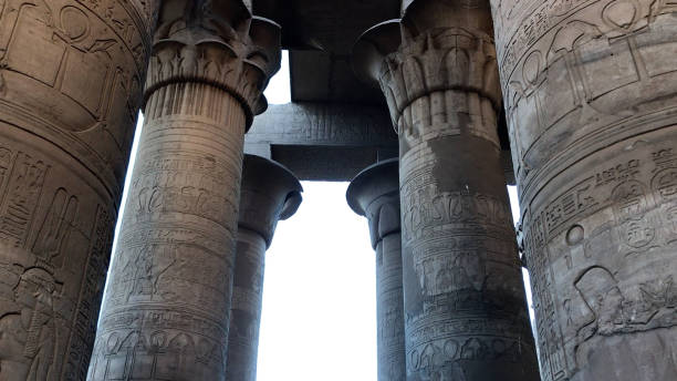 istock Preserved papyrus shaped column and ceiling at Kom Ombo Temple, Egypt. 1496321997