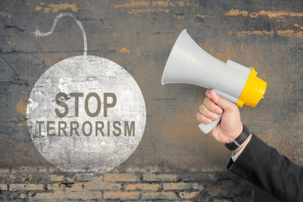 Businessman showing stop terrorism sign stock photo