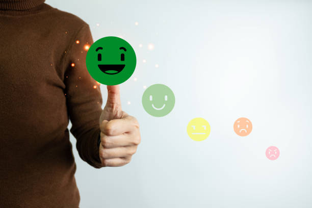 istock Customer satisfaction concept, client is satisfied with pressing the smiley face icon, excellent service, impressed with care, highest rating and score, good feedback from users. 1496325089