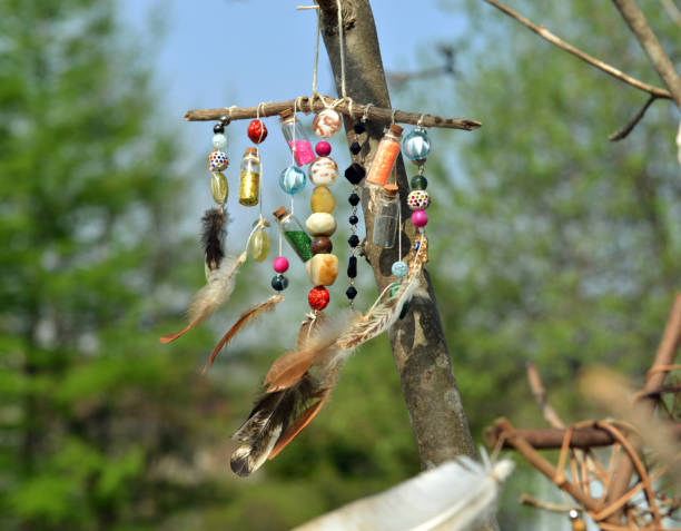 istock Decorated witchy dreamcatcher with little bottles and crystals. Occult, esoteric and divination still life. Mystic outside background with vintage object 1496326706
