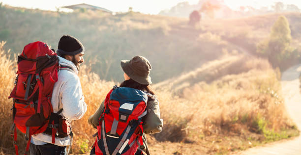 istock traveler couple with backpack standing looking view on mountain 1496326987