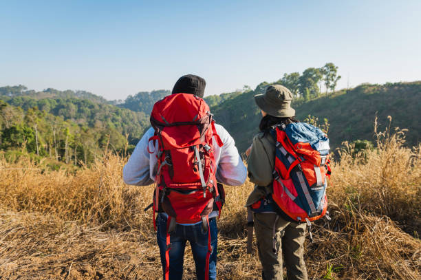 istock traveler couple with backpack standing looking view on mountain 1496326989