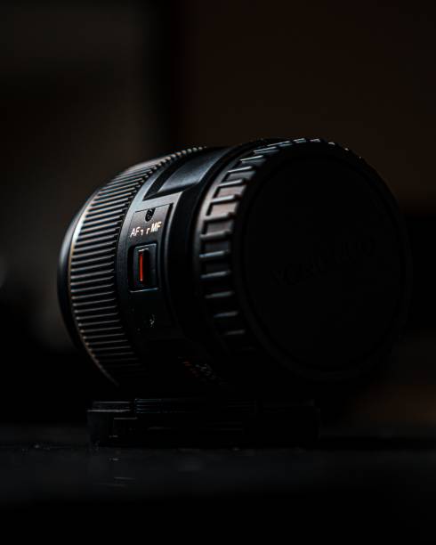 istock Close-up shot of a zoom camera lens on a table 1496327061