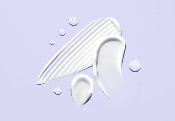 istock cosmetic smears cream texture on pastel purple background 1496327591